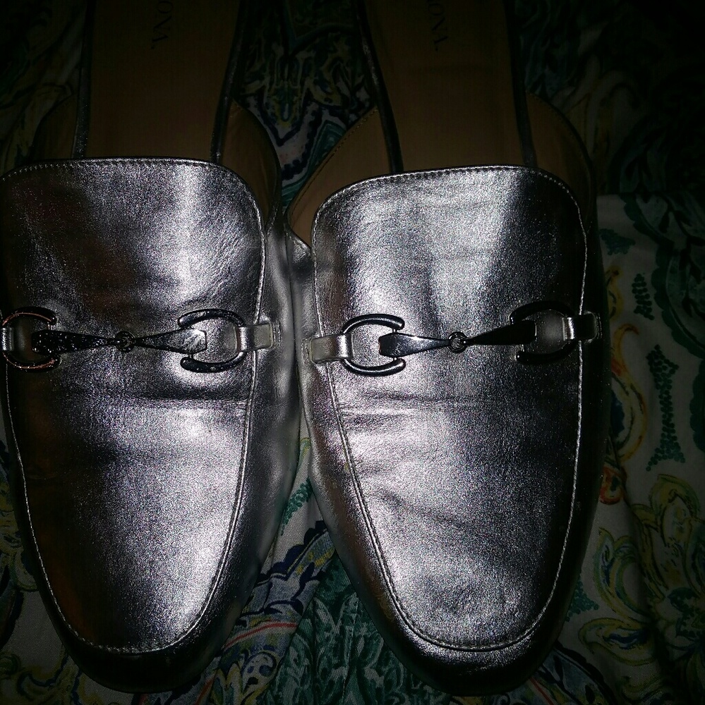 Silver loafer mules.